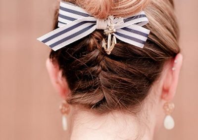 A woman with a bow in her hair.