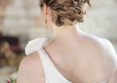 A woman with her hair in a bun.