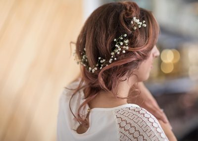 A woman with long hair and flowers in her hair.