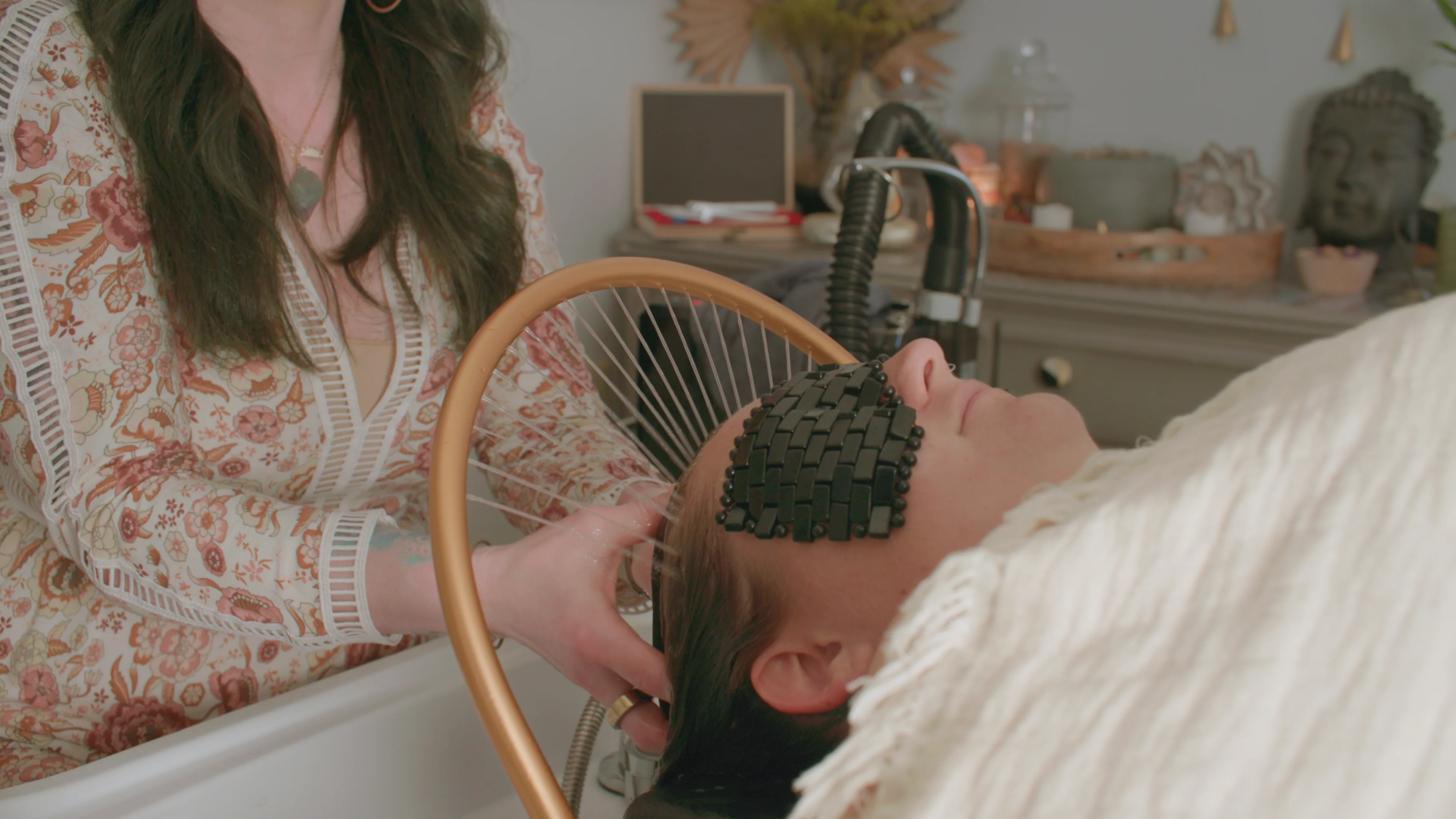 stylist giving client a head massage