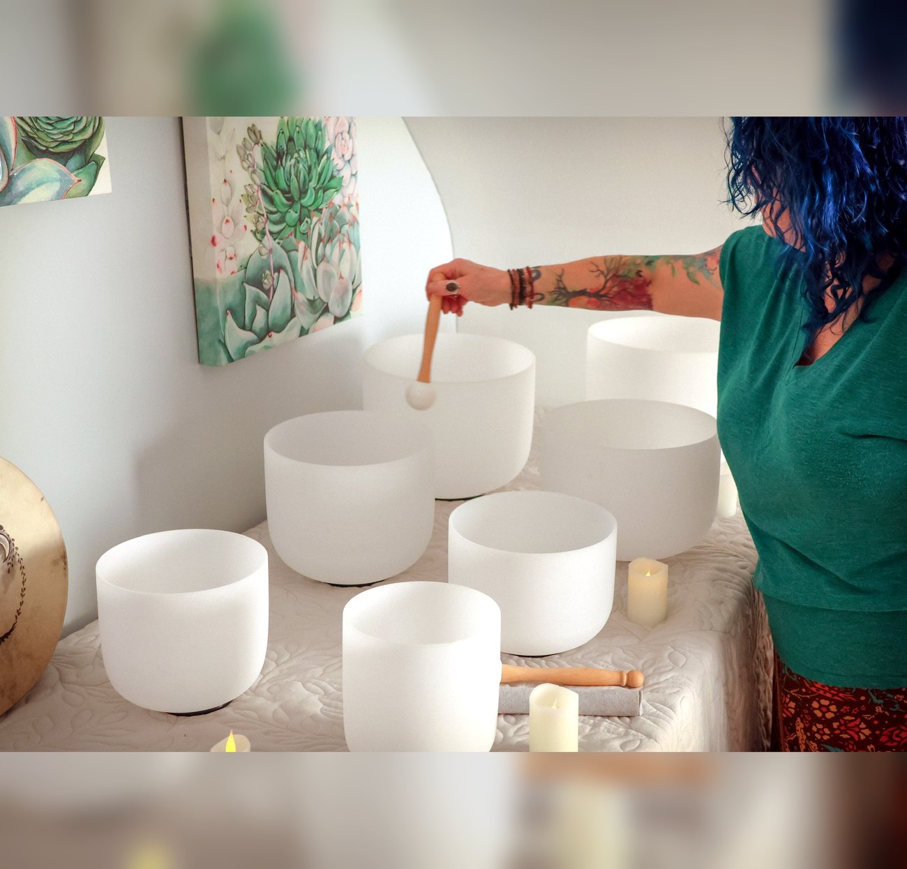 Crystal singing bowls being played during a sound healing session at Enlightened Styles in Warrenton, VA