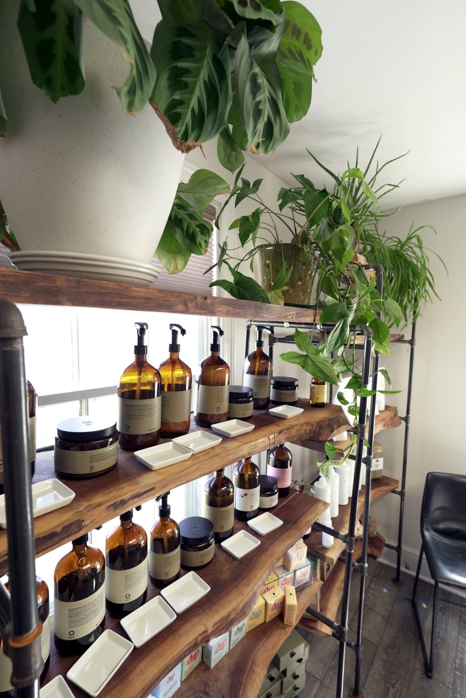 Amber refill bottles and clean beauty products at Enlightened Styles refillery in Warrenton, VA