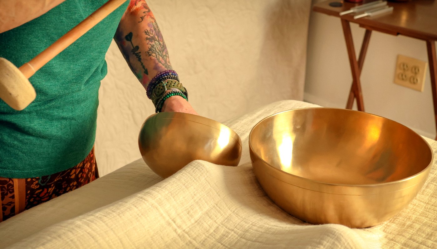 Tibetan brass singing bowls and tuning fork used in vibrational sound healing at Enlightened Styles in Warrenton, VA